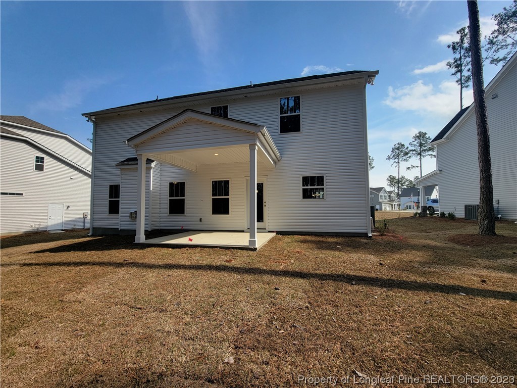 187 Timber Skip Drive Spring Lake, NC 28390 - Photo 2 of 20 a view of a house with a yard