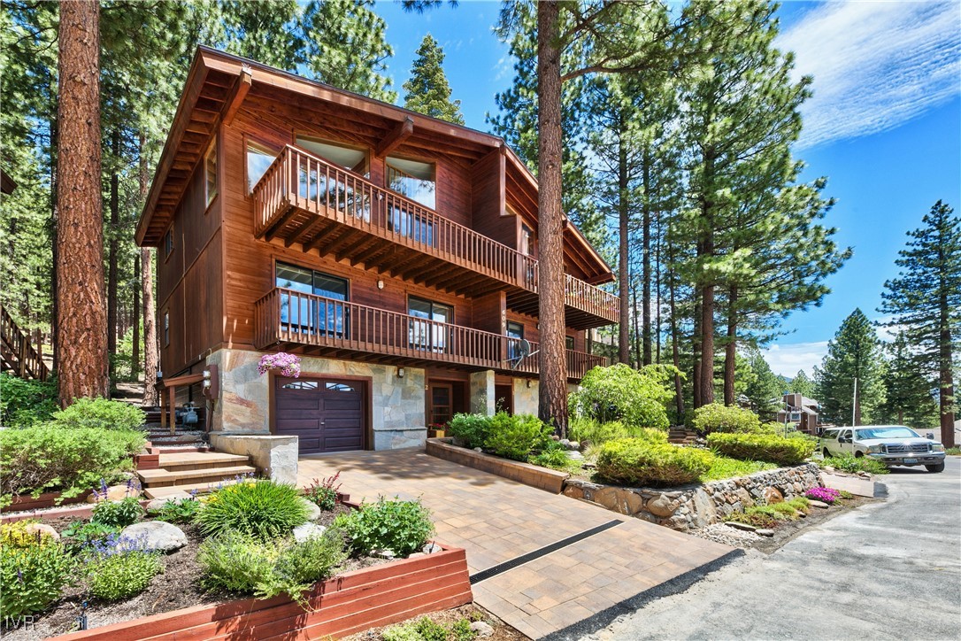 609 Lariat Circle, Unit 2 Incline Village, NV 89451 - Photo 1 of 24 a red brick building with trees in front of it