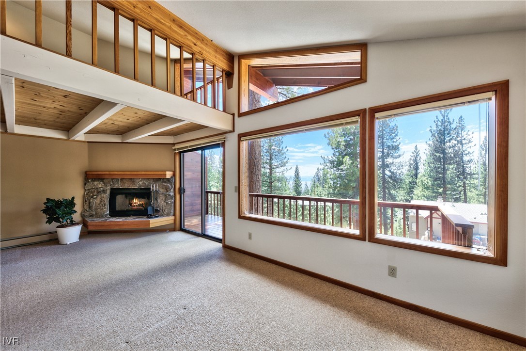 609 Lariat Circle, Unit 2 Incline Village, NV 89451 - Photo 4 of 24 a view of an empty room with wooden floor and a fireplace