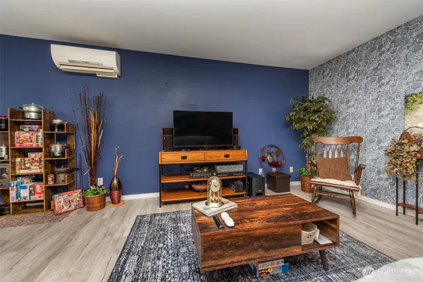 a room with furniture and a flat screen tv