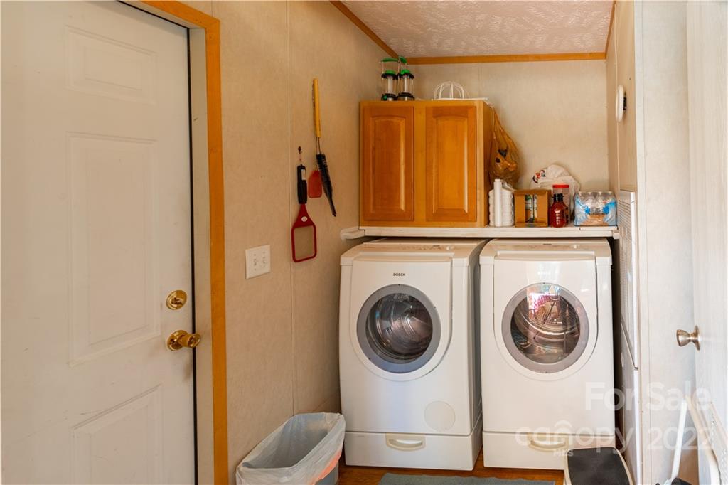 48 Lynn Estate Road Hendersonville, NC 28792 - Photo 12 of 23 a view of a hallway with washer and dryer