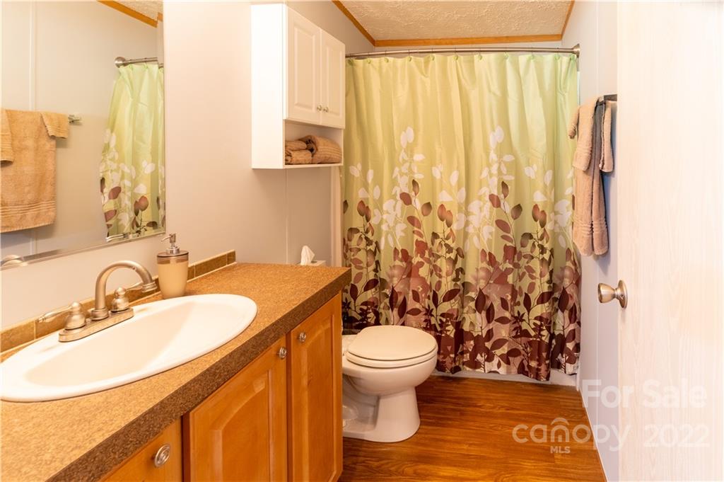 48 Lynn Estate Road Hendersonville, NC 28792 - Photo 18 of 23 a bathroom with a sink toilet and shower