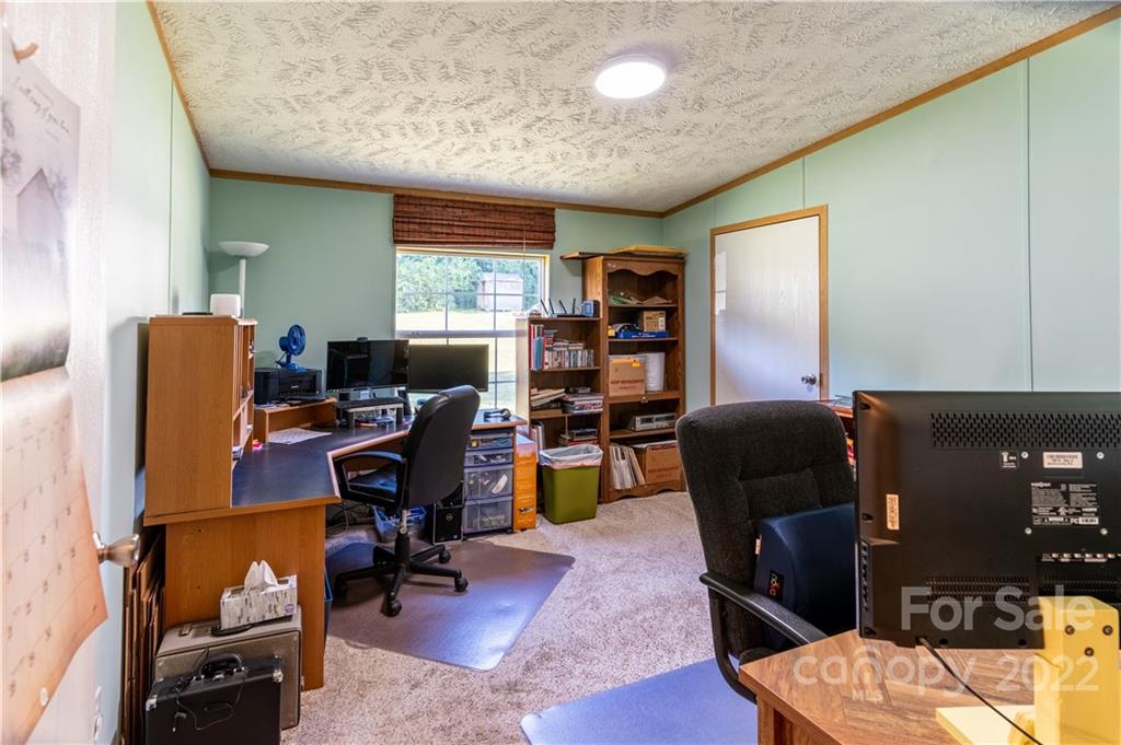 48 Lynn Estate Road Hendersonville, NC 28792 - Photo 20 of 23 a view of a workspace with furniture and a window