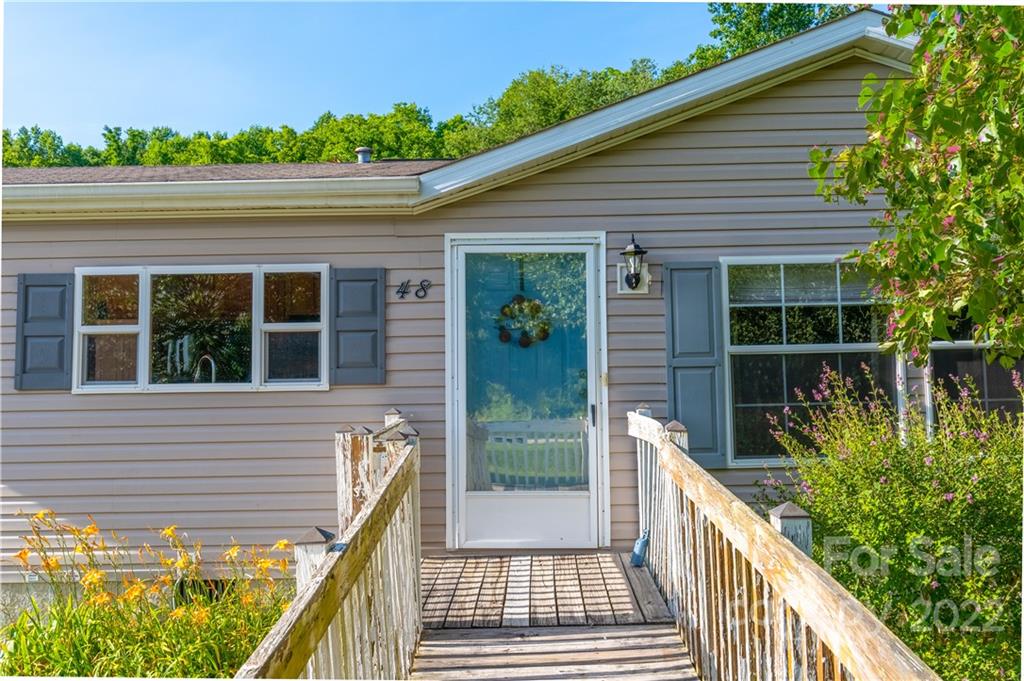 48 Lynn Estate Road Hendersonville, NC 28792 - Photo 2 of 23 a view of a house with a porch