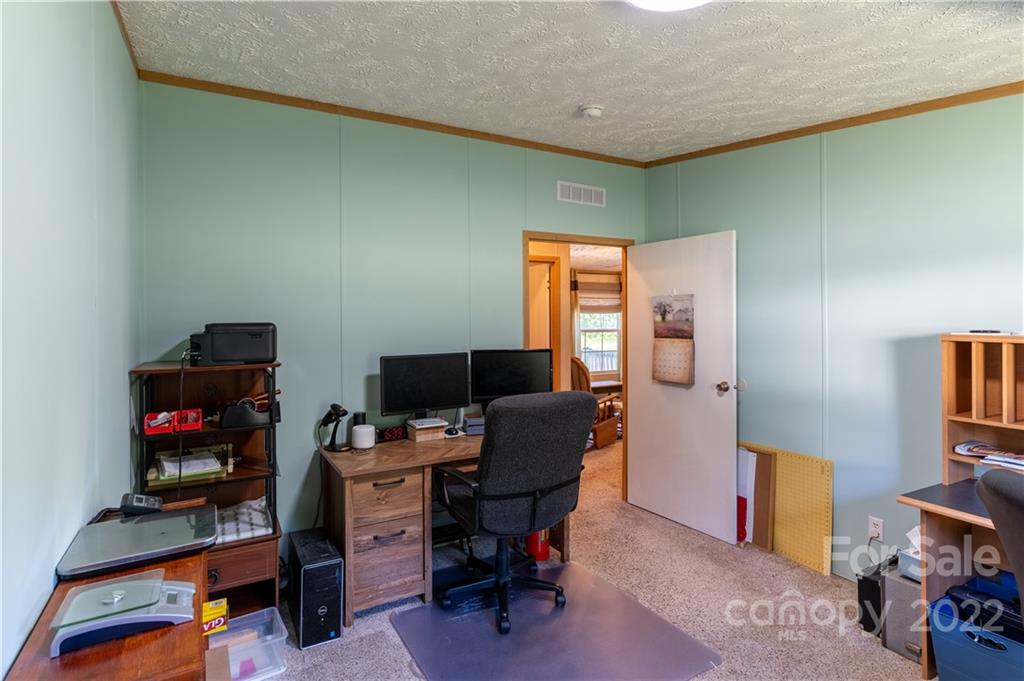 48 Lynn Estate Road Hendersonville, NC 28792 - Photo 21 of 23 a view of a workspace with furniture and a livingroom