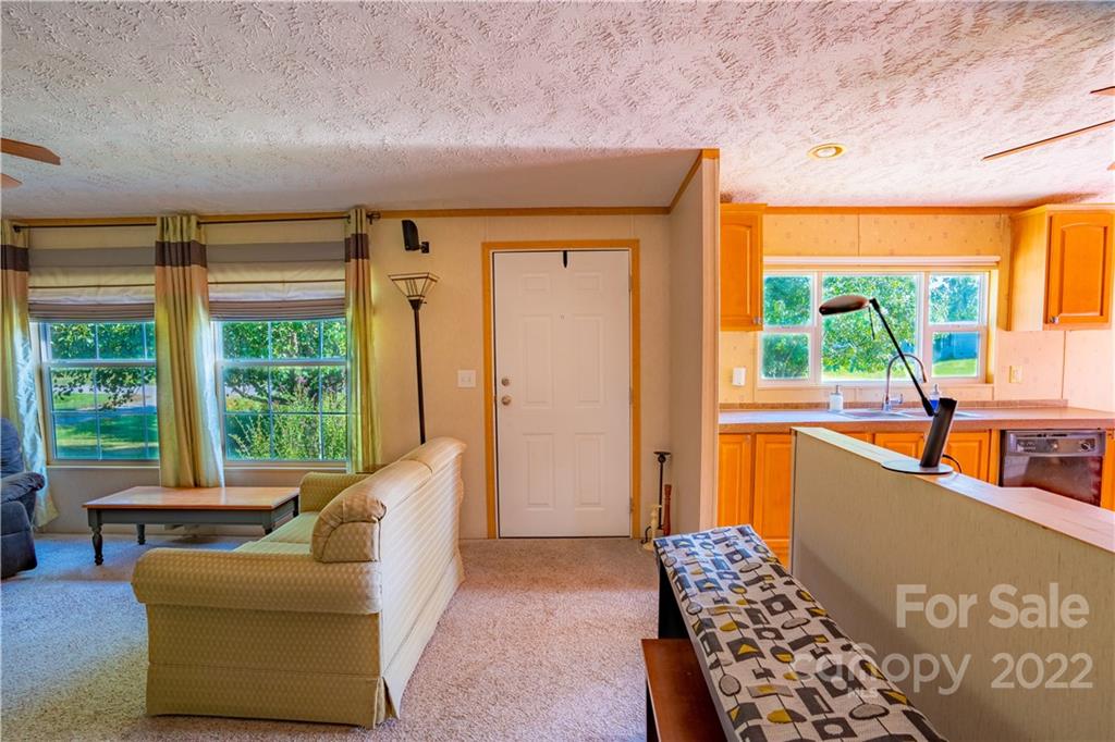48 Lynn Estate Road Hendersonville, NC 28792 - Photo 4 of 23 a living room with furniture and a large window