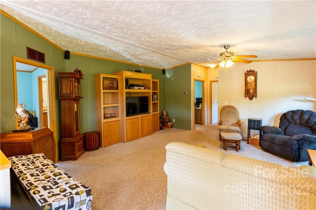 48 Lynn Estate Road Hendersonville, NC 28792 - Photo 7 of 23 a bedroom with a bed dresser and a large window