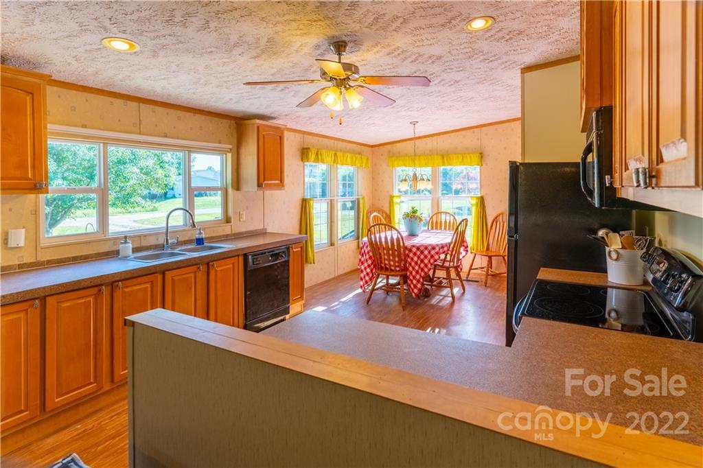 48 Lynn Estate Road Hendersonville, NC 28792 - Photo 8 of 23 a view of a kitchen with dining table and appliances