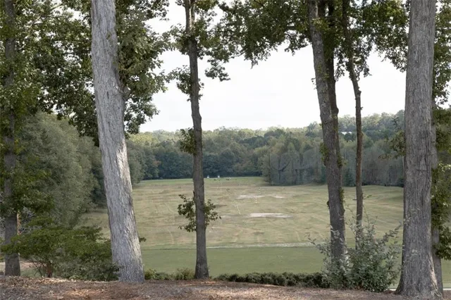 a view of house with outdoor space and seating area