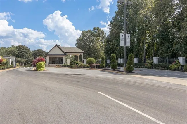 a front view of a house with a yard table and chairs