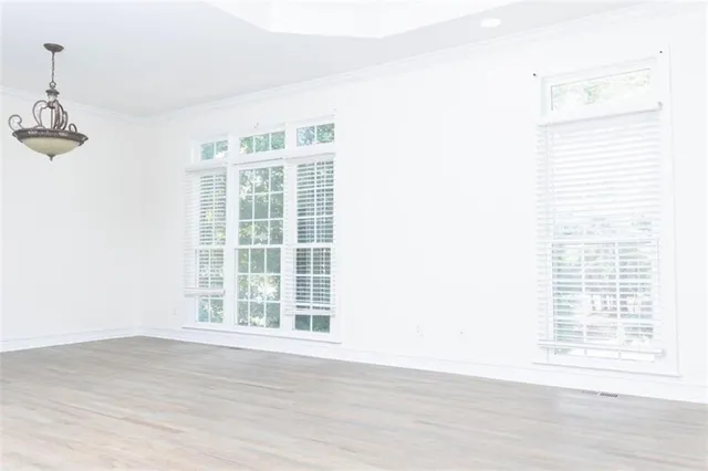 a bathroom with a window and a ceiling fan