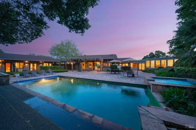 a view of swimming pool with outdoor seating