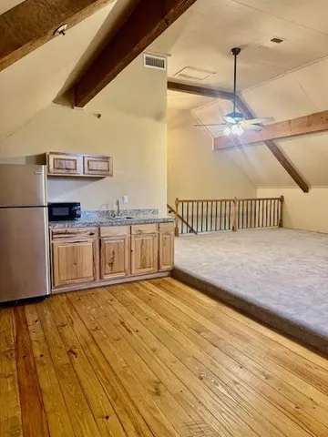 a view of kitchen with wooden floor