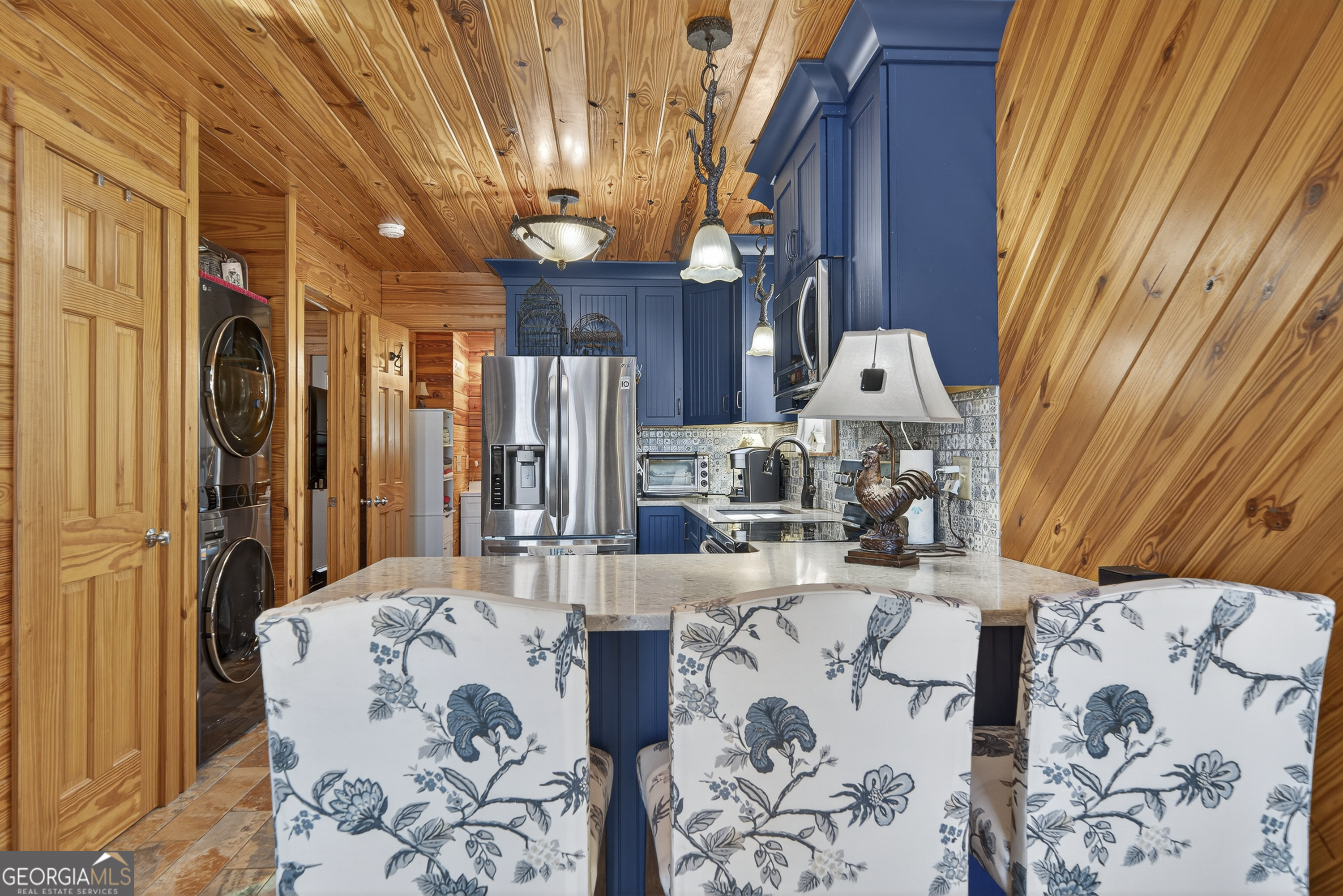 955 Barbara Point Road Sparta, GA 31087 - Photo 15 of 54 a living room with furniture and a fireplace