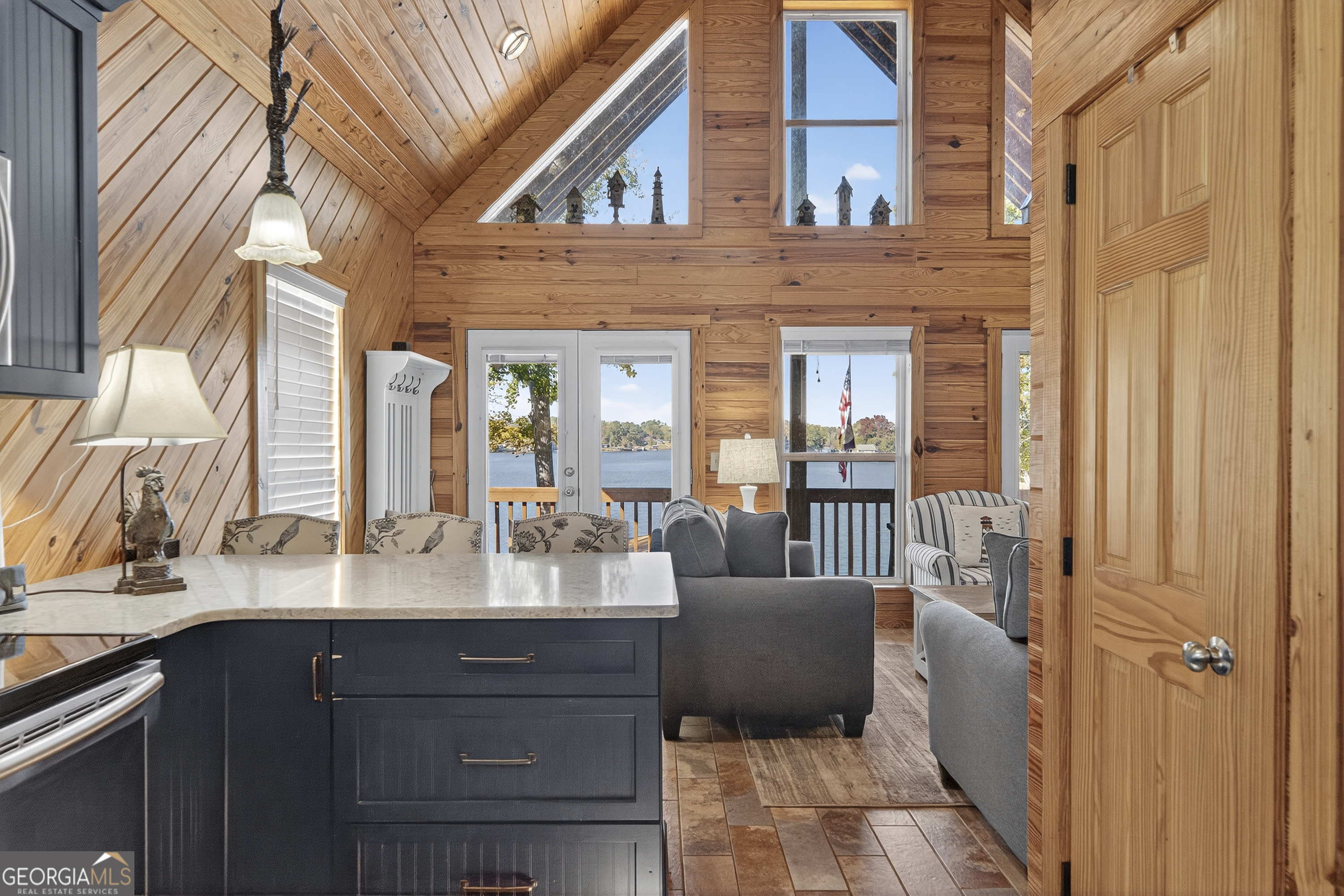 955 Barbara Point Road Sparta, GA 31087 - Photo 17 of 54 a bathroom with a double vanity sink and a mirror