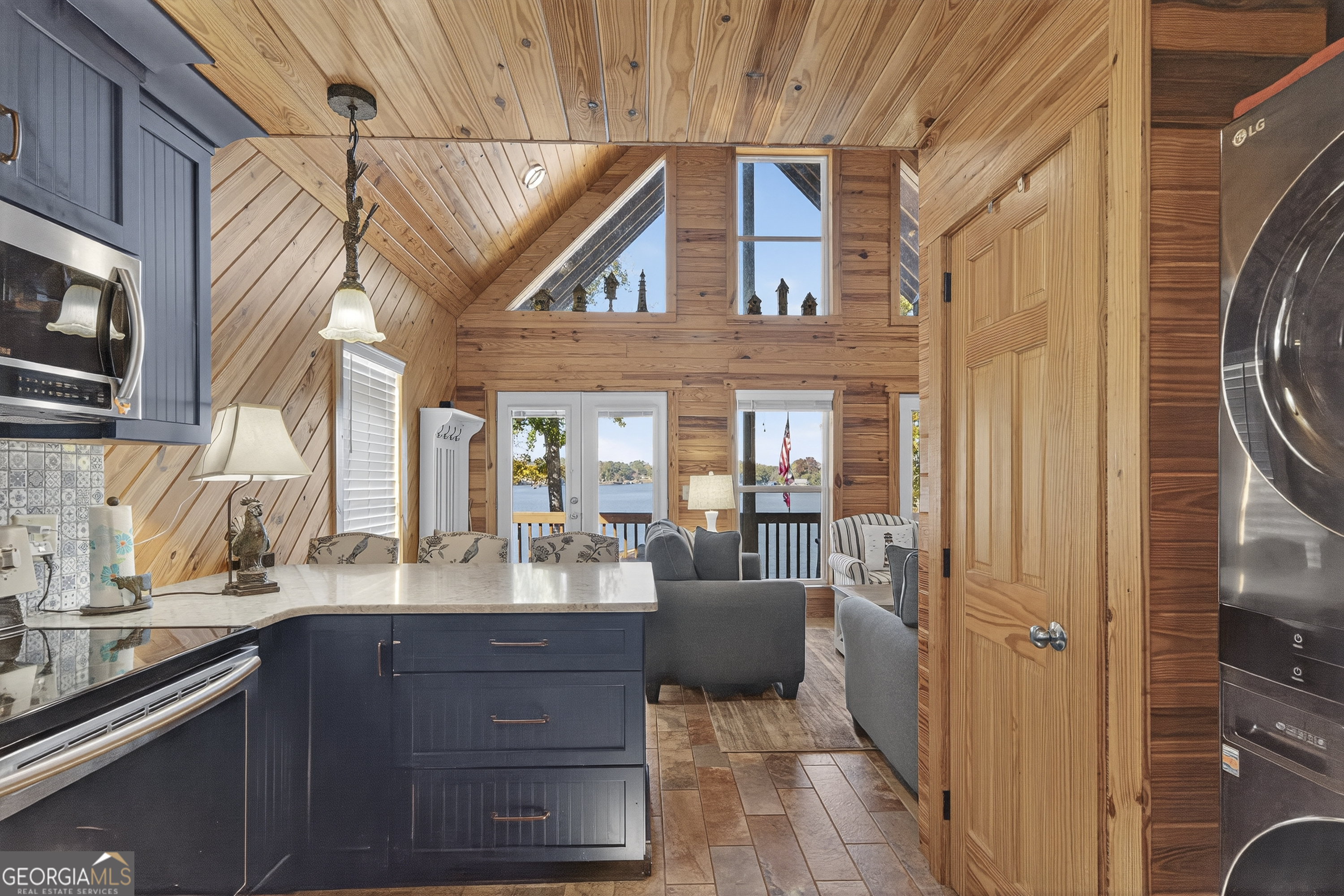 955 Barbara Point Road Sparta, GA 31087 - Photo 18 of 54 a kitchen with a sink cabinets and appliances