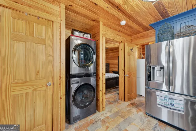 a view of a storage and utility room with washer and dryer