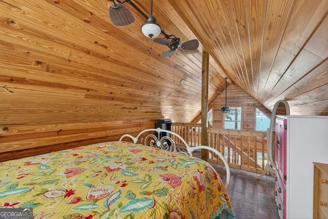a view of balcony with wooden floor and fence