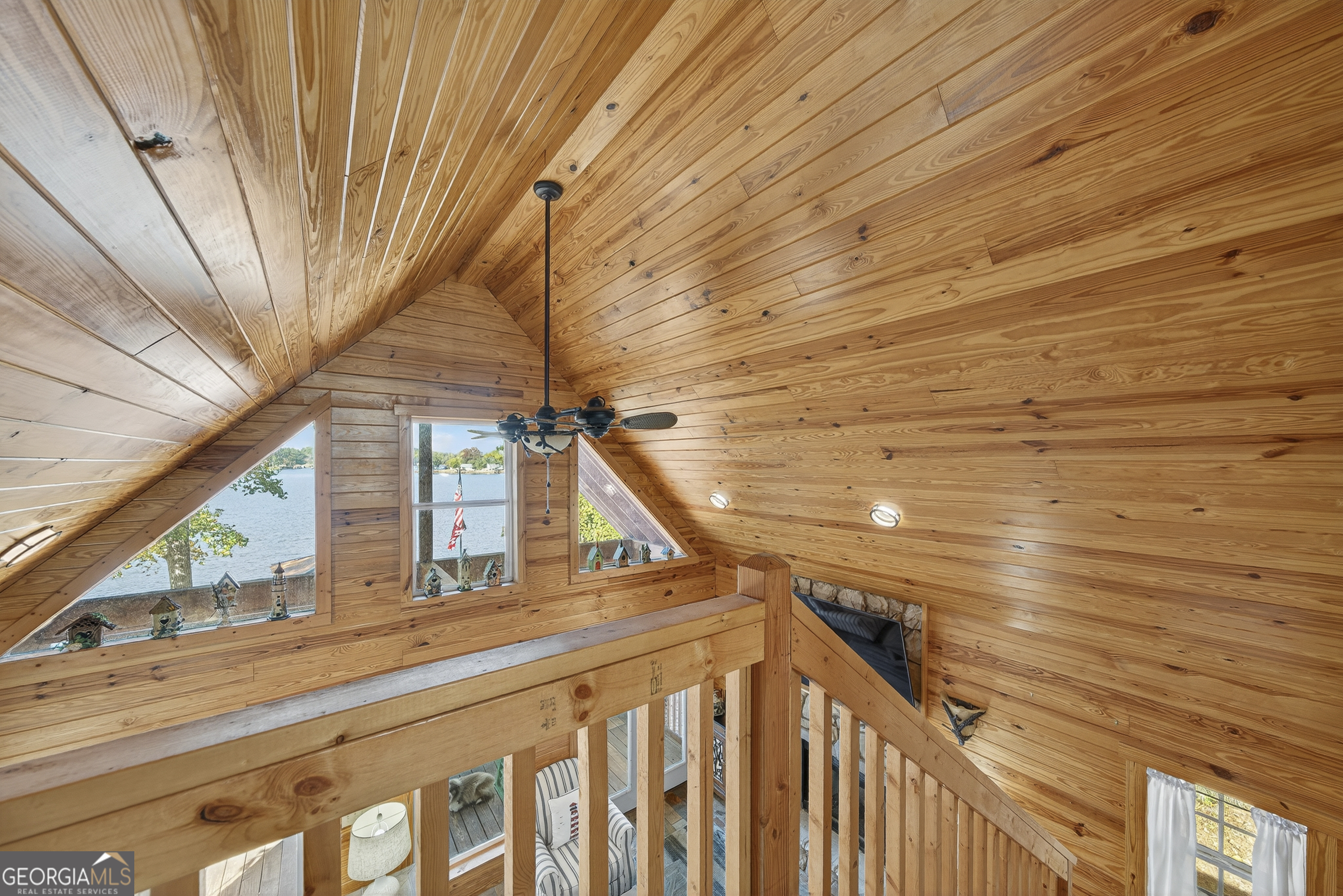 955 Barbara Point Road Sparta, GA 31087 - Photo 28 of 54 a view of balcony with wooden floor and fence