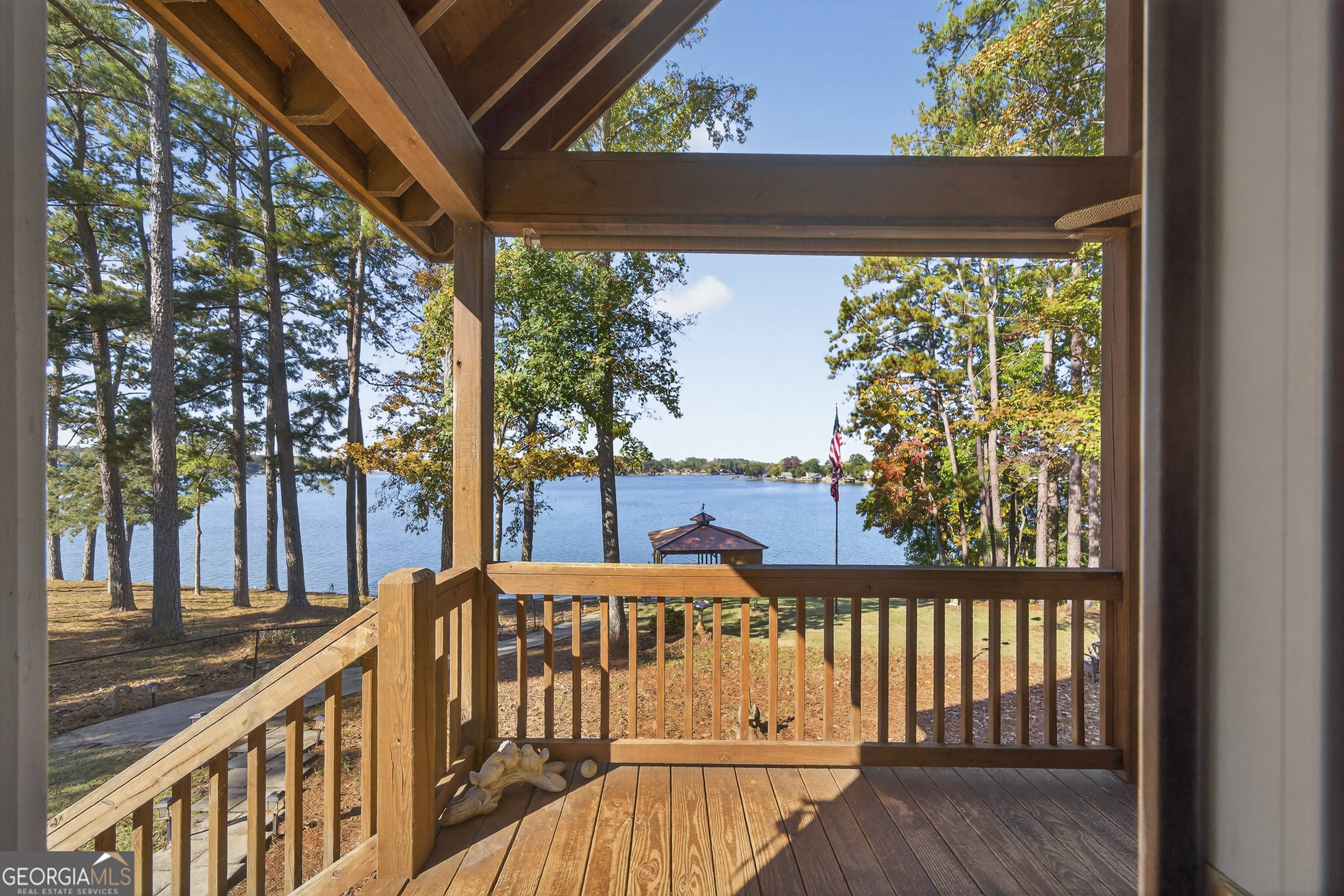 955 Barbara Point Road Sparta, GA 31087 - Photo 31 of 54 a view of a porch with furniture and garden