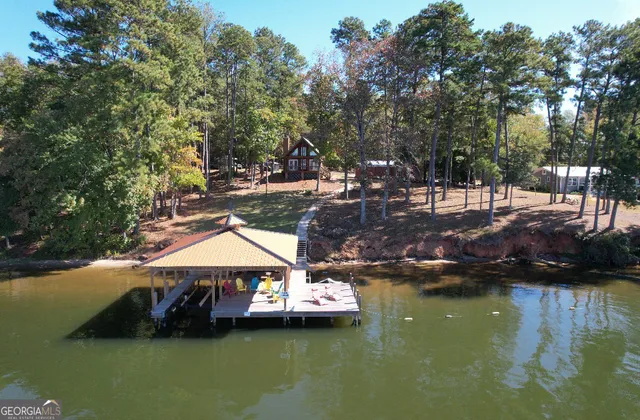 a small pool with lawn chairs