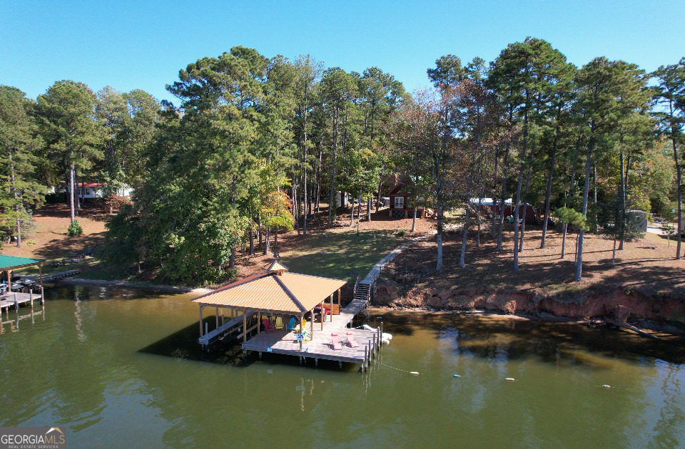 955 Barbara Point Road Sparta, GA 31087 - Photo 35 of 54 a view of a lake with houses