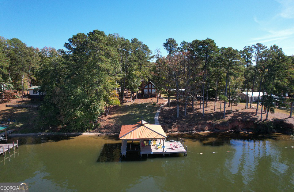 955 Barbara Point Road Sparta, GA 31087 - Photo 36 of 54 a small pool with lawn chairs