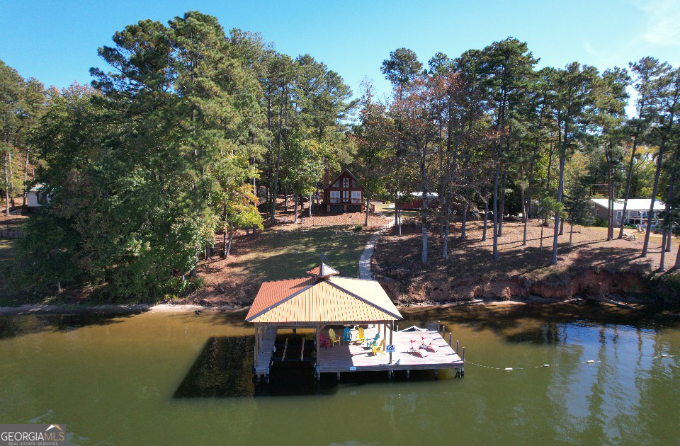 955 Barbara Point Road Sparta, GA 31087 - Photo 4 of 54 an aerial view of a house with swimming pool a yard and a patio