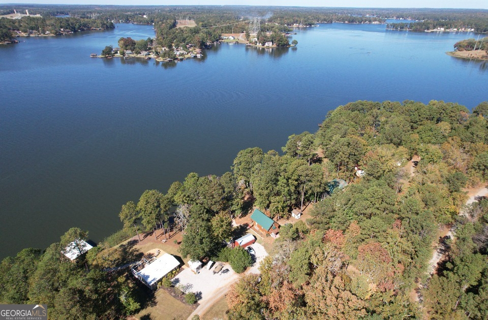955 Barbara Point Road Sparta, GA 31087 - Photo 41 of 54 an aerial view of a house with a lake view