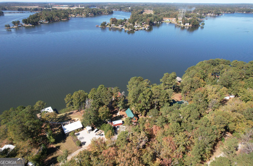 955 Barbara Point Road Sparta, GA 31087 - Photo 42 of 54 a view of a pond with sitting space