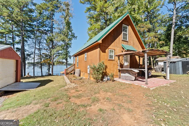 a front view of a house with a yard covered in snow