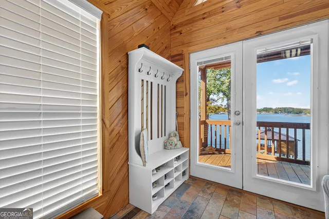 a view of front door and porch with wooden floor