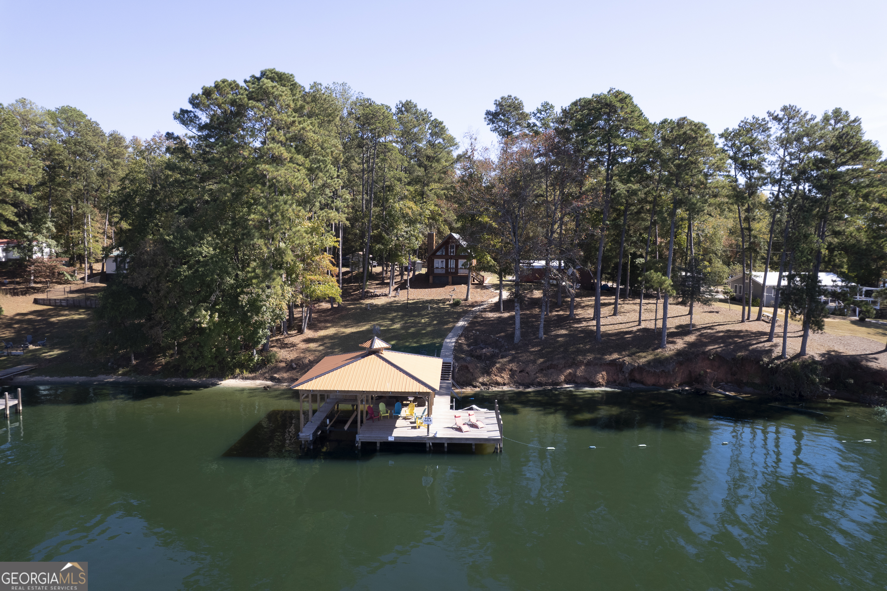 955 Barbara Point Road Sparta, GA 31087 - Photo 52 of 54 a view of a lake with houses