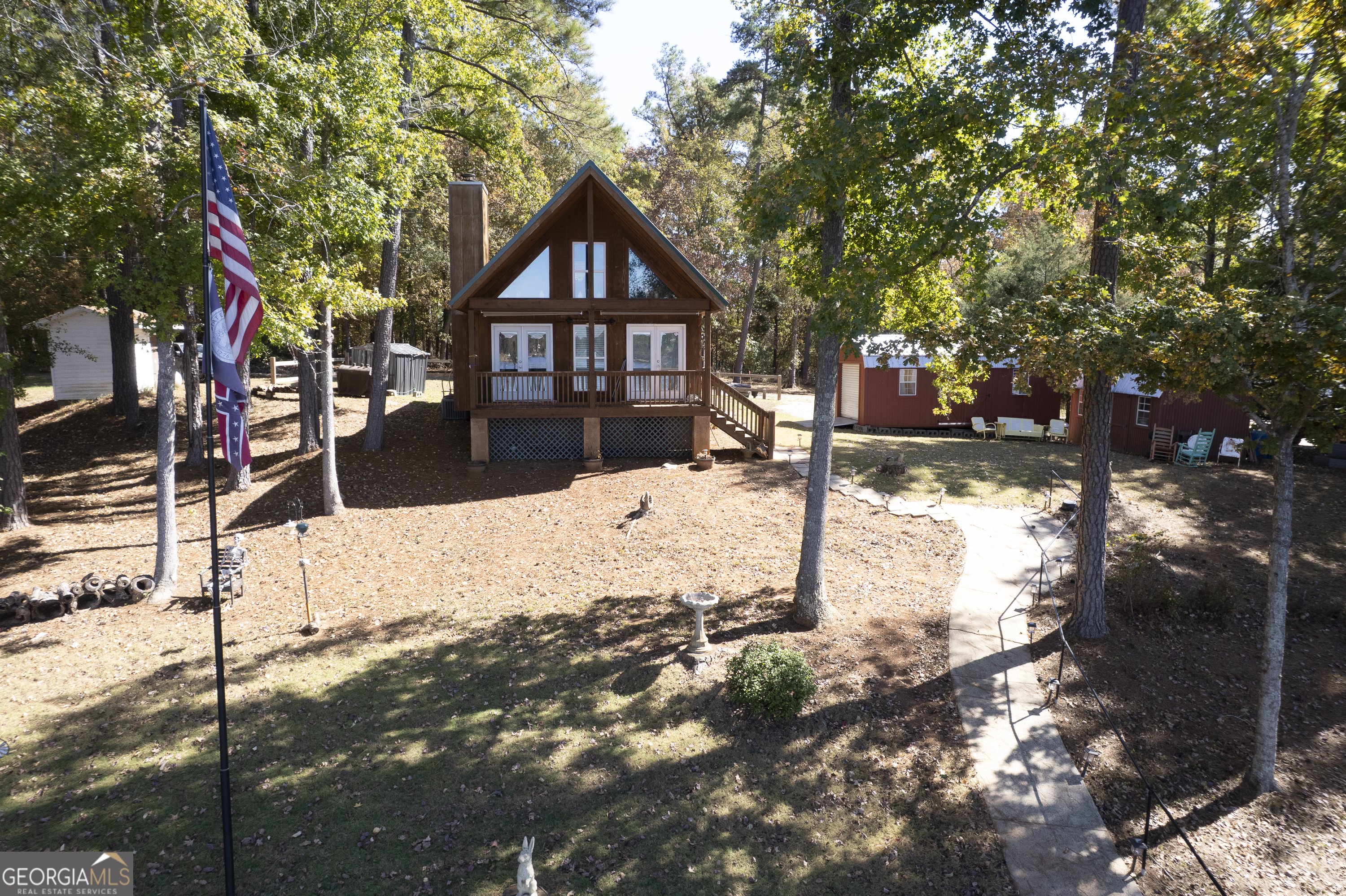 955 Barbara Point Road Sparta, GA 31087 - Photo 53 of 54 a front view of a house with a yard covered in snow