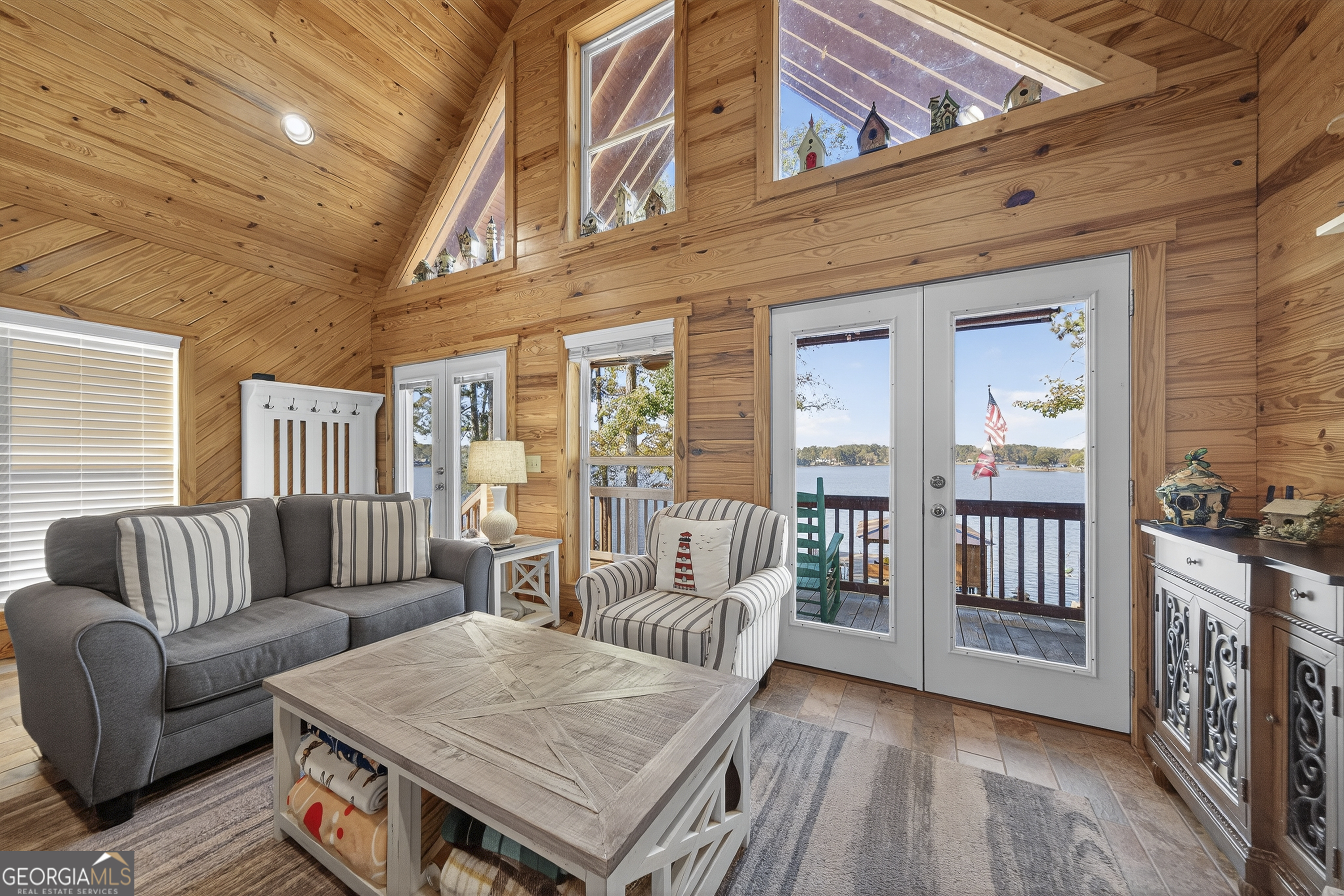 955 Barbara Point Road Sparta, GA 31087 - Photo 10 of 54 a living room with furniture and a table