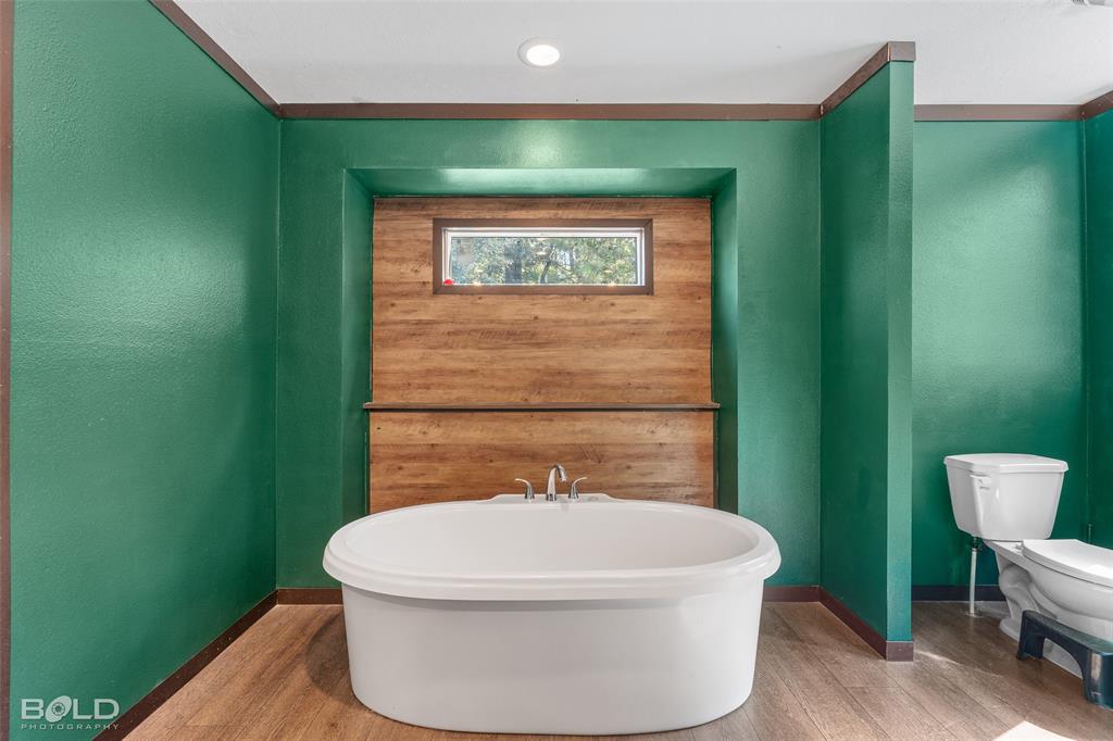 9489 Capps City Road Rodessa, LA 71069 - Photo 27 of 34 a bathroom with a toilet