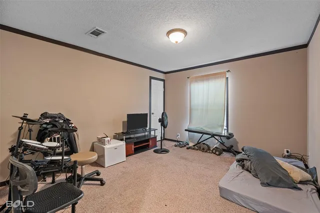 a bathroom with a granite countertop sink mirror vanity and toilet
