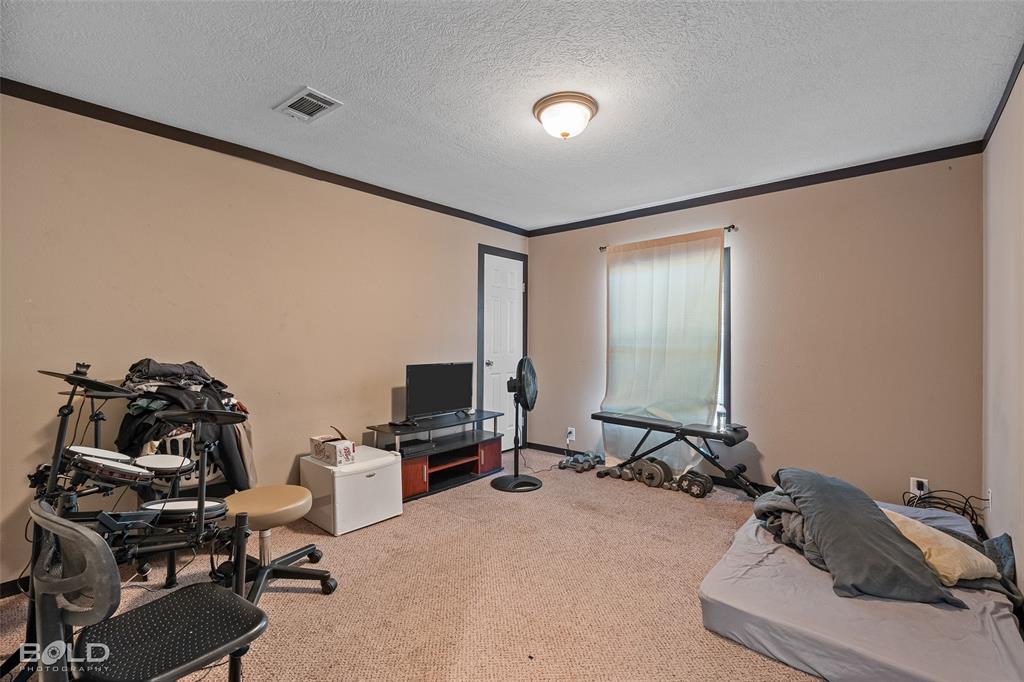 9489 Capps City Road Rodessa, LA 71069 - Photo 32 of 34 a view of a workspace with furniture and a window