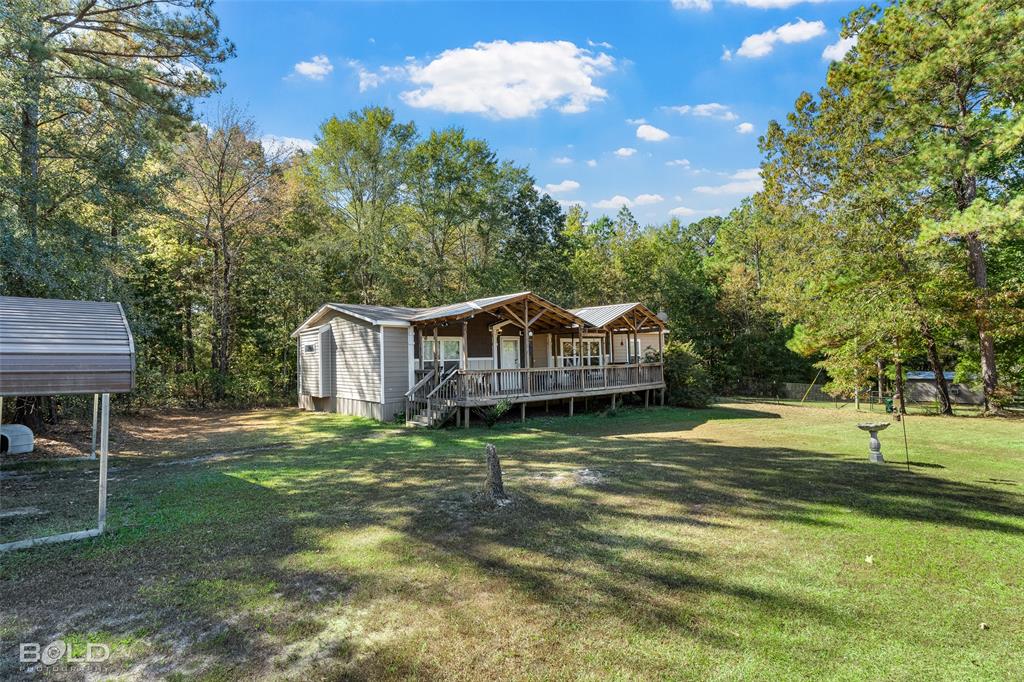 9489 Capps City Road Rodessa, LA 71069 - Photo 5 of 34 a view of a house with a yard