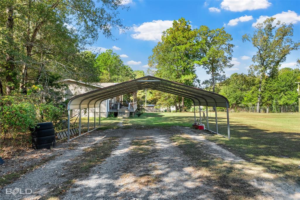 9489 Capps City Road Rodessa, LA 71069 - Photo 7 of 34 a view of backyard of house with green space