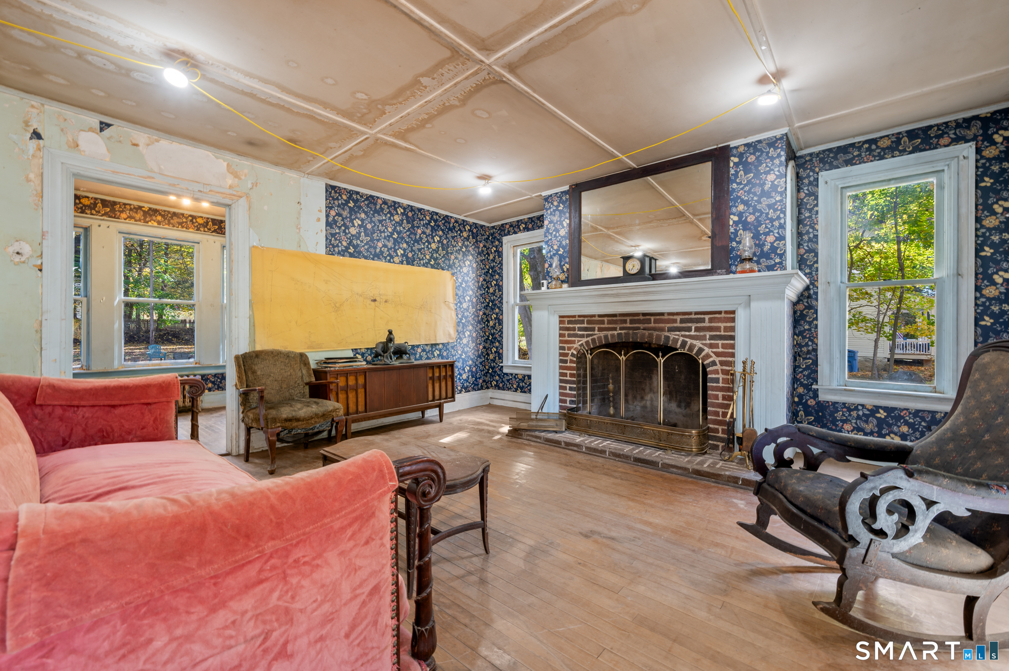 124 River Road Willington, CT 06279 - Photo 12 of 40 a living room with furniture fireplace and a large window