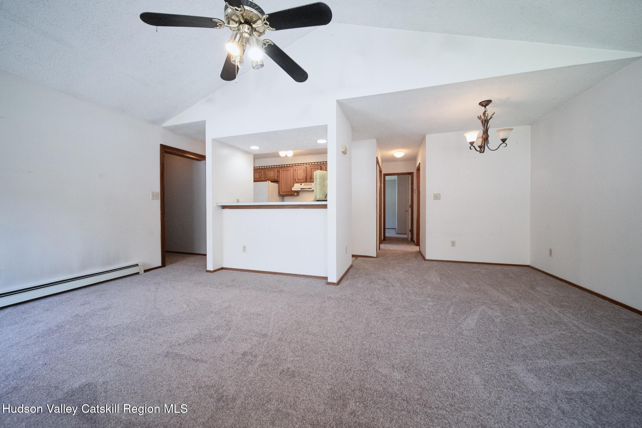 9 Rock Maple Road Saugerties, NY 12477 - Photo 12 of 30 an empty room with ceiling fan and windows