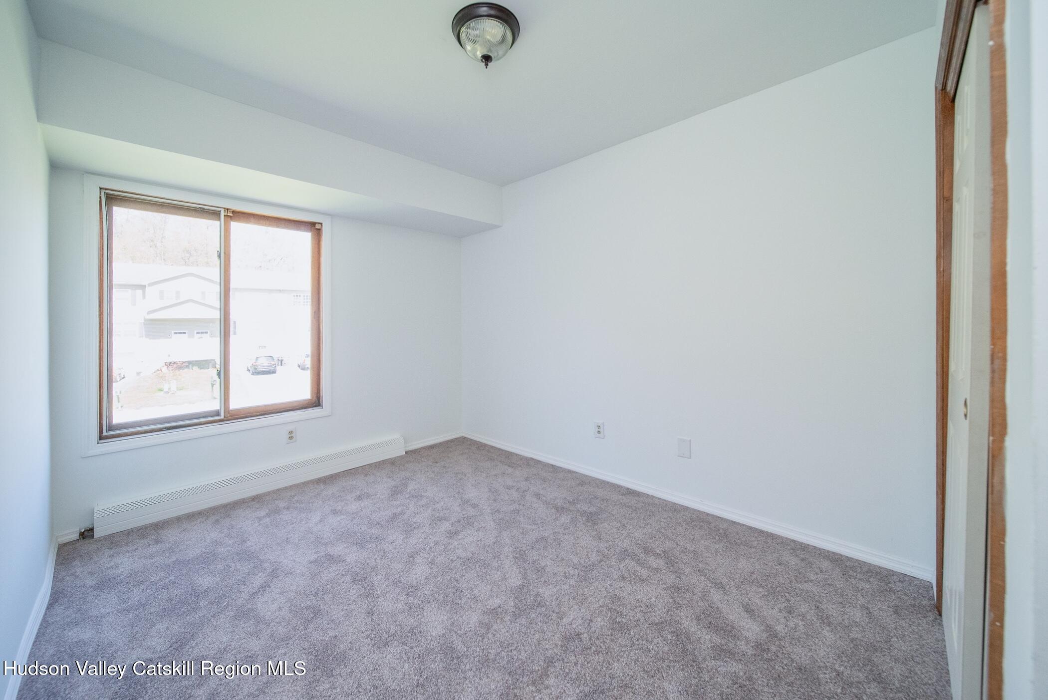 9 Rock Maple Road Saugerties, NY 12477 - Photo 14 of 30 an empty room with windows