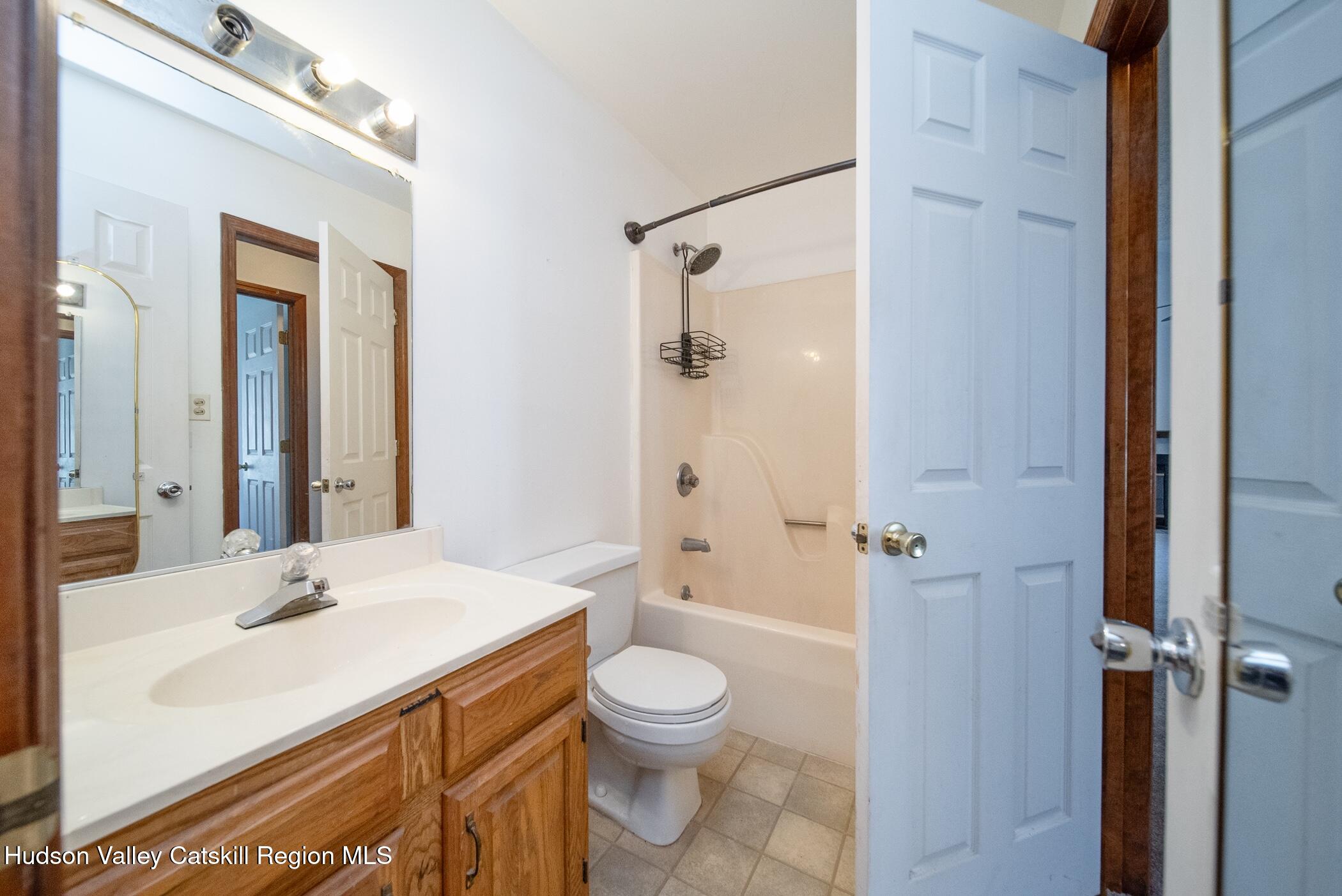 9 Rock Maple Road Saugerties, NY 12477 - Photo 17 of 30 a bathroom with a sink a toilet and shower