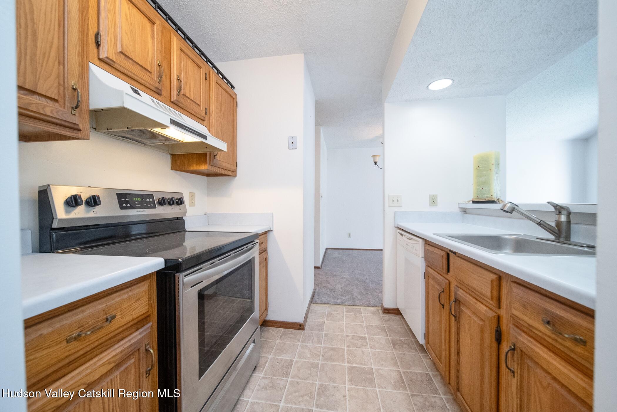9 Rock Maple Road Saugerties, NY 12477 - Photo 5 of 30 a kitchen with a sink stove and cabinets