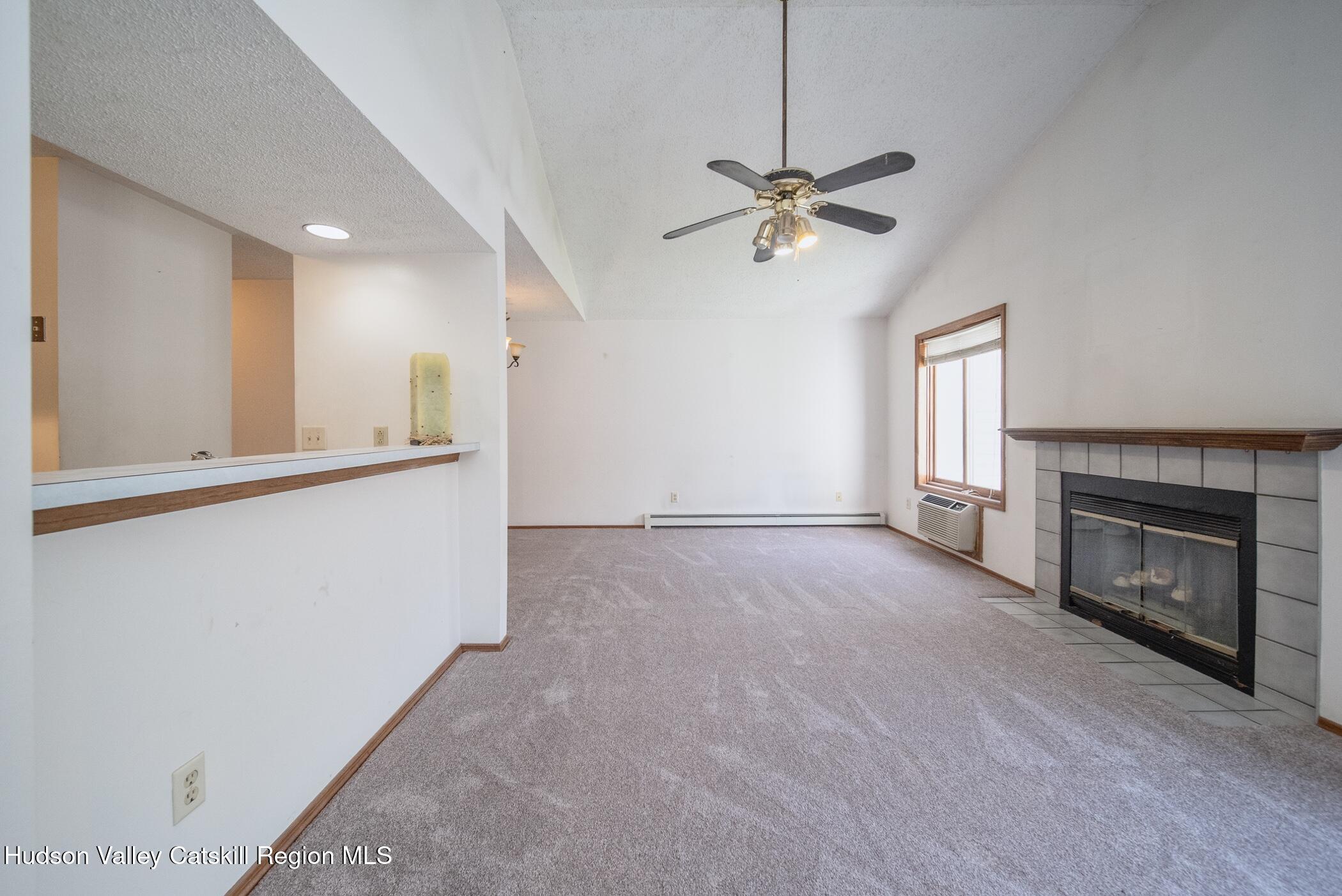 9 Rock Maple Road Saugerties, NY 12477 - Photo 10 of 30 a view of empty room with a fireplace and fan