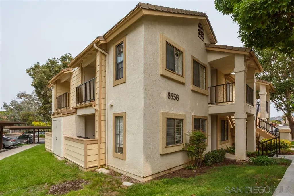 8558 Summerdale Road, Unit 133 San Diego, CA 92126 - Photo 2 of 14 a view of a house with a yard