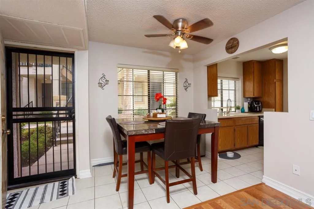 8558 Summerdale Road, Unit 133 San Diego, CA 92126 - Photo 4 of 14 a view of a dining room with furniture and window