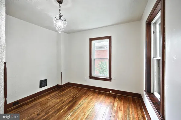a view of a balcony with wooden floor