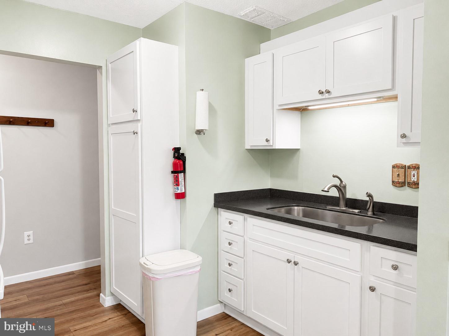 1724 Mosser Road, Unit 11 McHenry, MD 21541 - Photo 8 of 24 a bathroom with a granite countertop sink a toilet and a shower